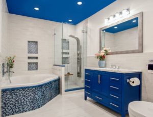 A bedroom with blue tile