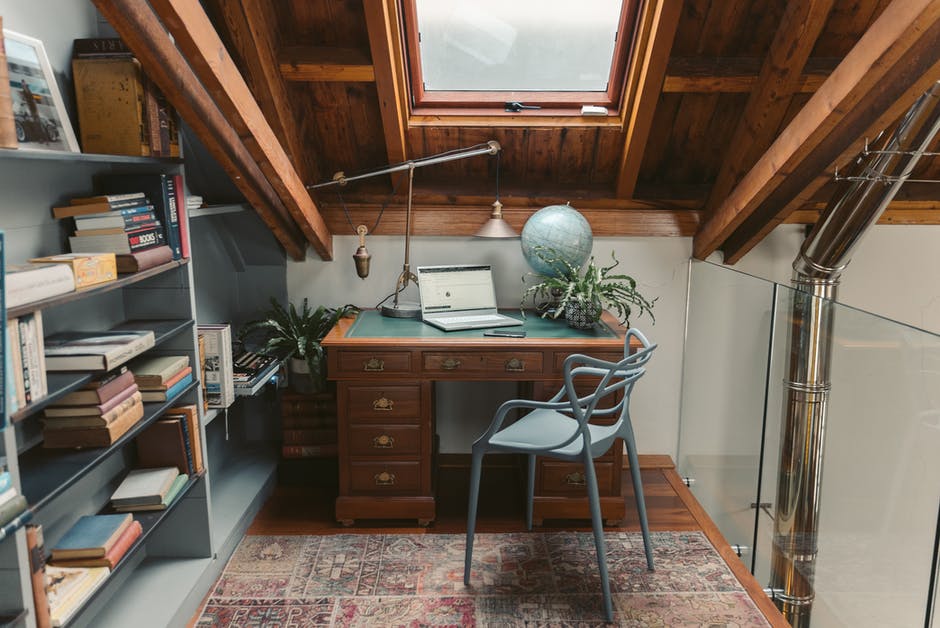 An office with a desk and chair in a room